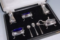 Lot 585 - A modern cased silver five piece cruet set,...