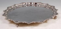 Lot 587 - A George V silver salver, having a shell cast...