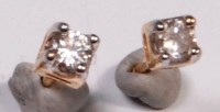 Lot 670 - A pair of yellow gold and diamond ear studs,...