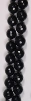 Lot 676 - A beaded black jade necklace, each faceted...