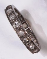 Lot 680 - A platinum diamond set eternity ring, the...