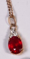 Lot 690 - A contemporary 9ct gold, ruby and diamond...