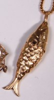 Lot 692 - A 9ct gold reticulated fish pendant, 4cm, on a...