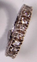 Lot 702 - A white metal diamond eternity ring, arranged...