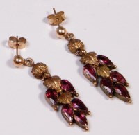 Lot 706 - A pair of circa 1900 garnet set pinchbeck ear...