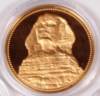 Lot 735 - An Egyptian gold 100 pound coin, 0.9 purity,...