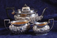 Lot 601 - A George V silver three piece teaset,...