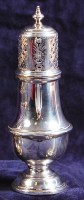 Lot 617 - A silver pedestal lighthouse sugar castor,...