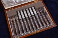 Lot 630 - A cased set of six silver cake knives and...