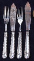 Lot 650 - A set of six Edwardian silver fish knives and...