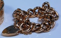 Lot 662 - A 9ct gold curblink bracelet, with padlock...