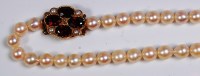 Lot 665 - A cultured pearl single string necklace,...