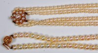 Lot 666 - A cultured and graduated pearl double string...