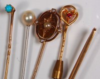 Lot 669 - Four various tie pins, to include; three gold...