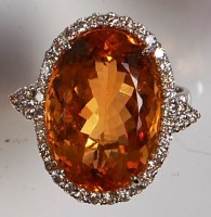 Lot 672 - A contemporary 18ct white gold, citrine and...