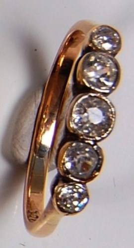 Lot 690 - An 18ct gold diamond dress ring, arranged as...