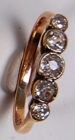Lot 690 - An 18ct gold diamond dress ring, arranged as...