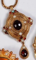 Lot 697 - A gilt metal cabochon garnet and seed pearl...