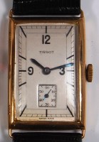 Lot 724 - A Tissot 9ct gold cased gents tank watch,...