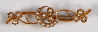 Lot 732 - A circa 1900 9ct gold and seed pearl set bar...