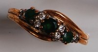 Lot 739 - A contemporary 9ct gold emerald and diamond...