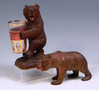 Lot 801 - Two Black Forest carved bears, one in standing...