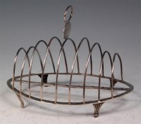 Lot 173 - A George III silver eight division toast-rack,...