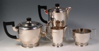 Lot 132 - An Art Deco influenced silver four piece tea...