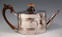 Lot 144 - A George III silver teapot, of banded oval...