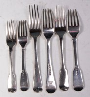 Lot 152 - A set of five George III silver table forks,...