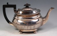 Lot 155 - A late Victorian silver teapot, of half reeded...