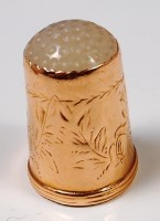 Lot 301 - A 19th century 14ct gold hardstone set thimble,...