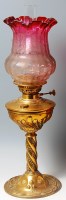 Lot 306 - An Art Nouveau brass pedestal oil lamp, having...