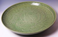 Lot 66 - A Chinese celadon ware footed charger, of good...