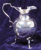 Lot 135 - A late Victorian silver cream jug, of helmet...