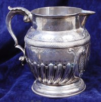 Lot 154 - A late Victorian silver milk jug, of barrel...