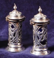 Lot 176 - A pair of Edwardian silver pepperettes, each...