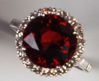 Lot 220 - A contemporary 14ct white gold garnet and...