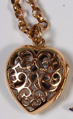 Lot 222 - A 9ct gold pierced heart pendant, 2cm, on a...