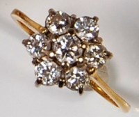 Lot 233 - An 18ct gold ladies diamond cluster ring, the...