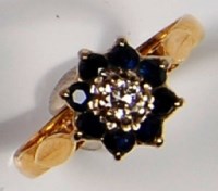 Lot 235 - An 18ct gold, sapphire and diamond cluster...