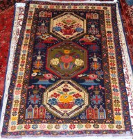 Lot 507 - A Persian woollen blue ground rug, the poled...