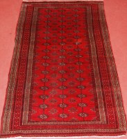 Lot 511 - A Persian woollen fineweave Bokhara rug, the...