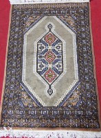 Lot 514 - A Persian woollen prayer rug, having a green...