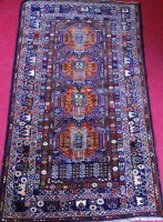 Lot 516 - A Persian Herat type rug, the central blue...