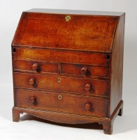 Lot 525 - A George III oak slopefront writing bureau,...