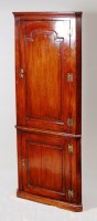 Lot 527 - An antique fruitwood and walnut freestanding...