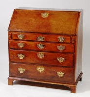 Lot 530 - An early George III walnut writing bureau,...