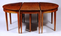 Lot 531 - A George III mahogany double D-end dining...