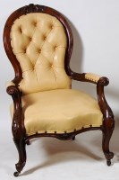 Lot 543 - A Victorian walnut spoonback library armchair,...